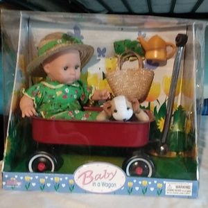 Baby in a wagon porcelain Doll